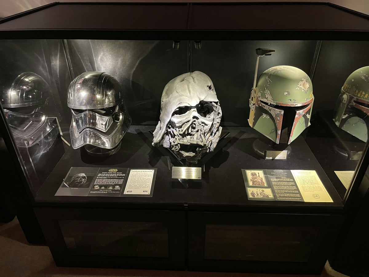 Star Wars helmet collection in a dark museum-style Moducase